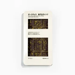 Chocolat noir fourré de yuzu et de pépites d'oranges